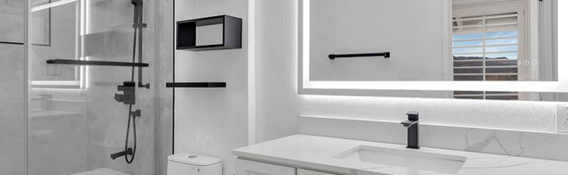 Pearl white bathroom with LED light around mirror