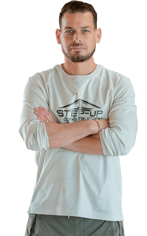 Gabriel B., Owner, standing with his arms crossed
