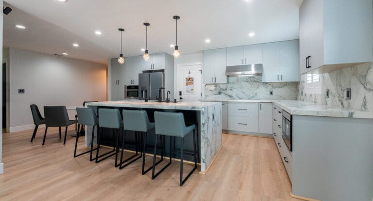 Kitchen with marble walls and eating island